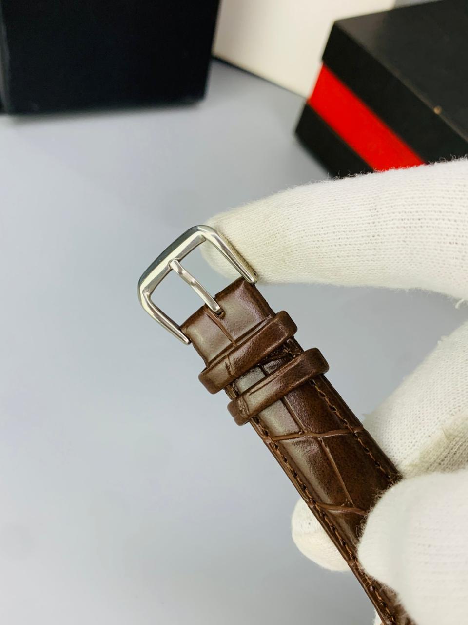 CT  BROWN DIAL BROWN STRAP